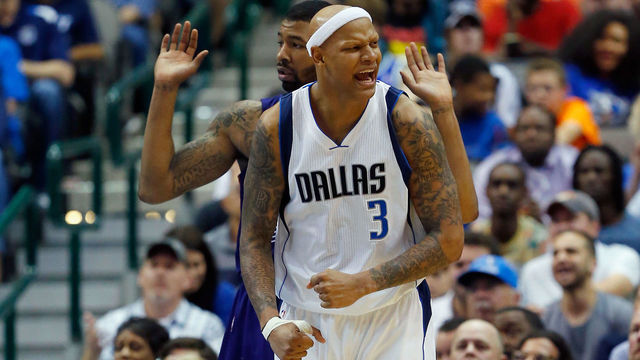 DALLAS, TX - APRIL 08: Charlie Villanueva #3 of the Dallas Mavericks celebrates after drawing a foul from Markieff Morris #11 of the Phoenix Suns in the second half at American Airlines Center on April 8, 2015 in Dallas, Texas. (Photo by Tom Pennington/Getty Images)