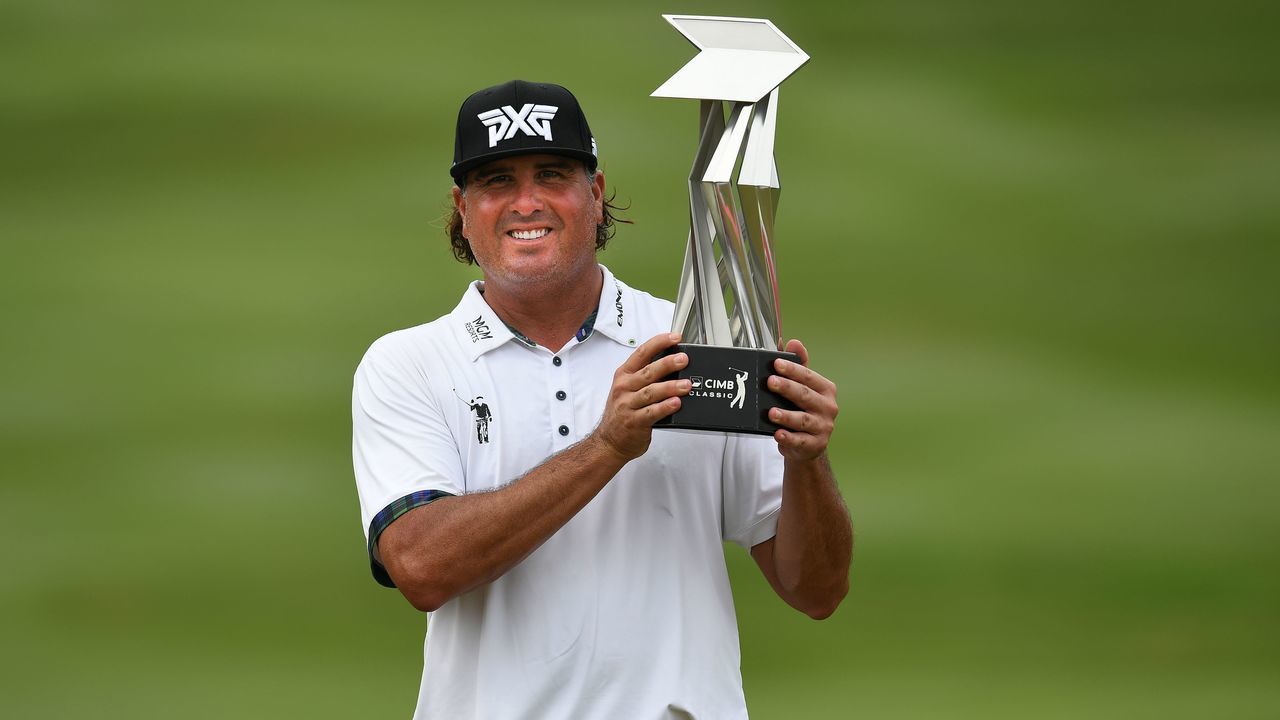 Pat Perez of the US lifts the trophy after winning the 2017 CIMB Classic golf tournament in Kuala Lumpur on October 15, 2017. / AFP PHOTO / Mohd RASFAN (Photo credit should read MOHD RASFAN/AFP/Getty Images)