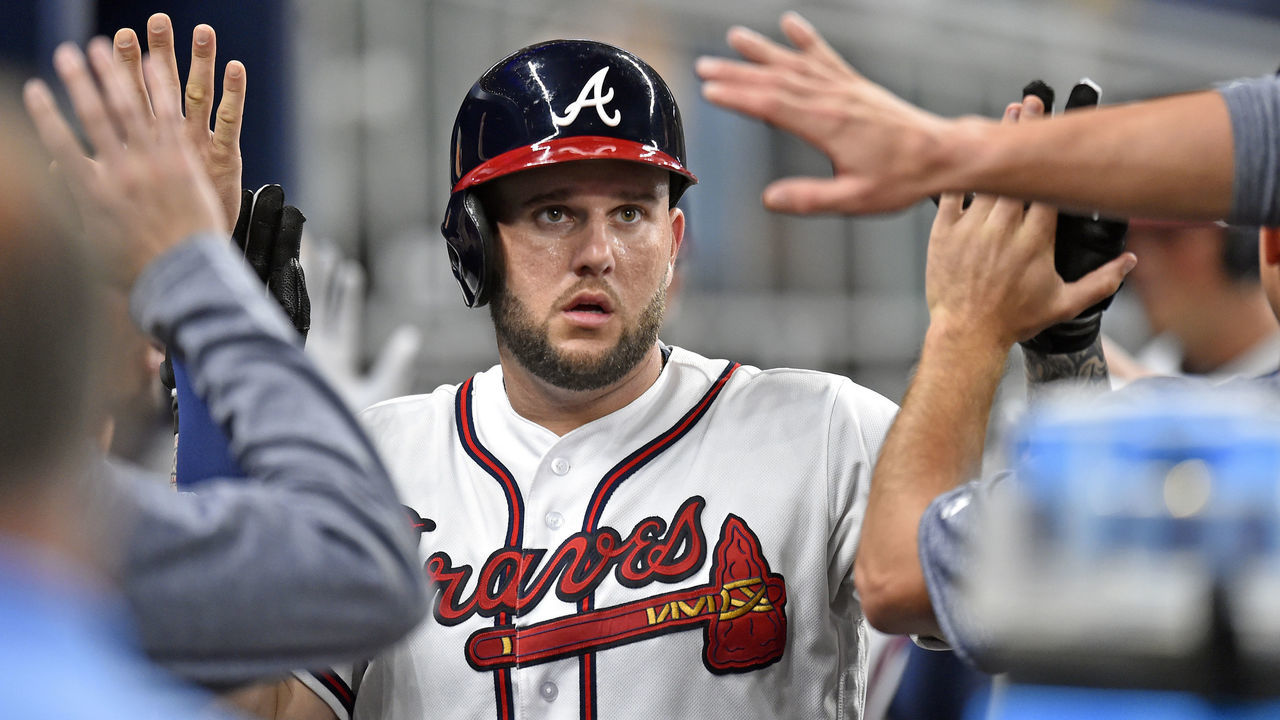 ATLANTA, GA - SEPTEMBER 4: Matt Adams #18 of the Atlanta Braves is congratulated by teammates after hitting a fourth inning two-run home run against the Texas Rangers at SunTrust Park on September 4, 2017 in Atlanta, Georgia. (Photo by Scott Cunningham/Getty Images)