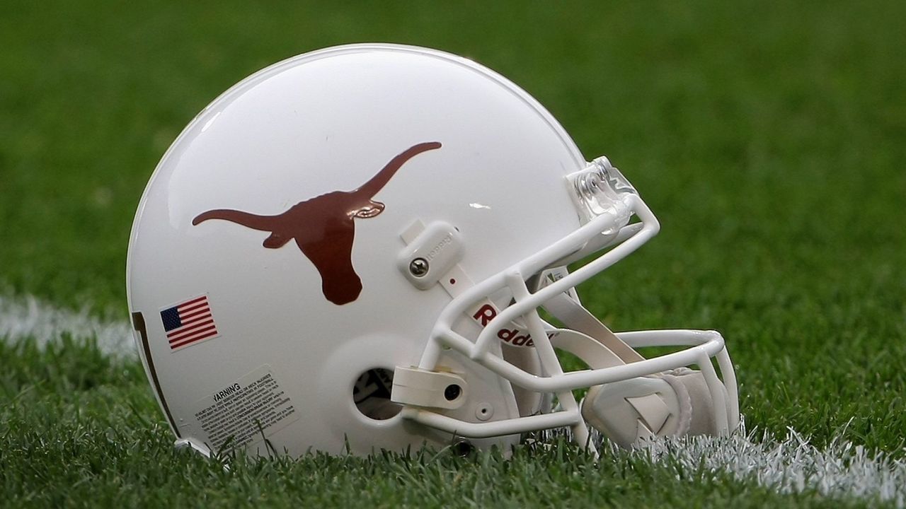 BOULDER, CO - OCTOBER 04: A helmet of the Texas Longhorns lies on the field as the team warms up prior to facing the Colorado Buffaloes at Folsom Field on October 4, 2008 in Boulder, Colorado. Texas defeated Colorado 38-14. (Photo by Doug Pensinger/Getty Images)