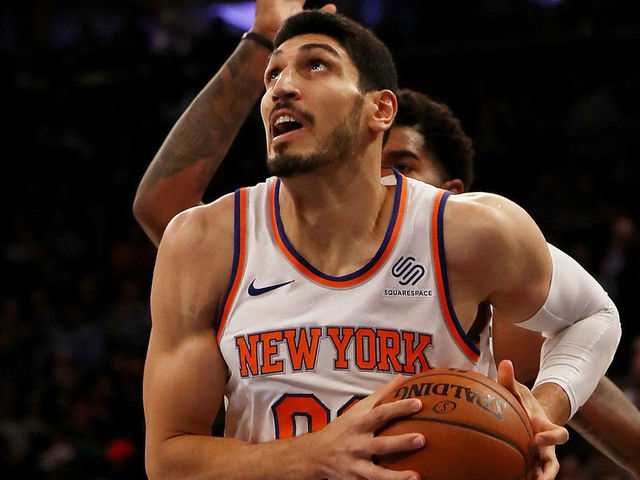NEW YORK, NY - NOVEMBER 03: Enes Kanter #00 of the New York Knicks heads for the net as Marquese Chriss #0 of the Phoenix Suns defends at Madison Square Garden on November 3, 2017 in New York City.