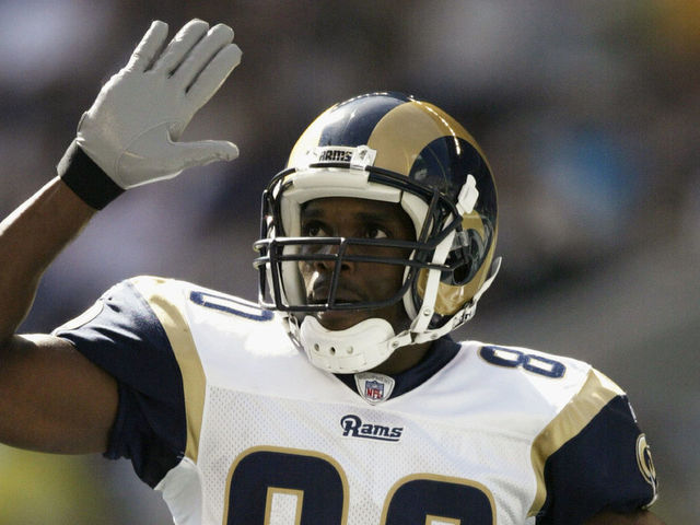 SEATTLE - SEPTEMBER 21: Wide Receiver Isaac Bruce #80 of the St. Louis Rams reacts after scoring a touchdown against the Seattle Seahawks at Seahawks Stadium on September 21, 2003 in Seattle, Washington. The Seahawks defeated the Rams 24-23.