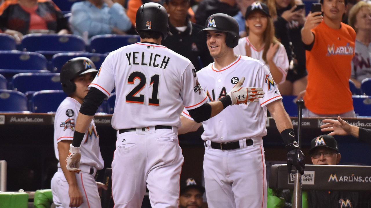 MIAMI, FL - SEPTEMBER 19: Christian Yelich #21 of the Miami Marlins is congratulated by J.T. Realmuto #11 after hitting a home run in the fourth inning against the New York Mets at Marlins Park on September 19, 2017 in Miami, Florida.