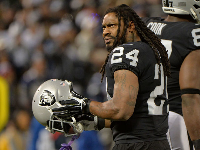 OAKLAND, CA - DECEMBER 17: Marshawn Lynch #24 of the Oakland Raiders looks on during their NFL game against the Dallas Cowboys at Oakland-Alameda County Coliseum on December 17, 2017 in Oakland, California.