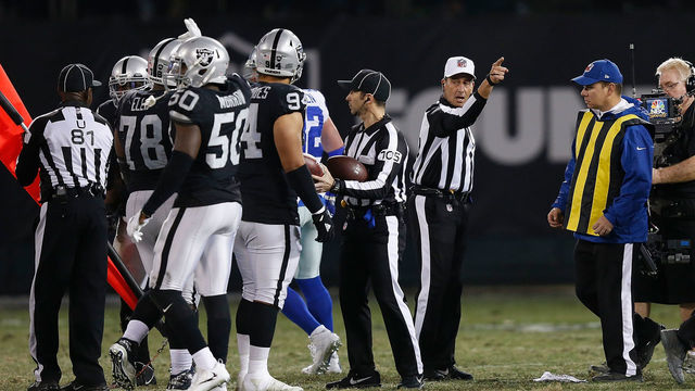 OAKLAND, CA - DECEMBER 17: Referee Gene Steratore #114 calls first down to Dallas during the game against the Oakland Raiders at Oakland-Alameda County Coliseum on December 17, 2017 in Oakland, California.