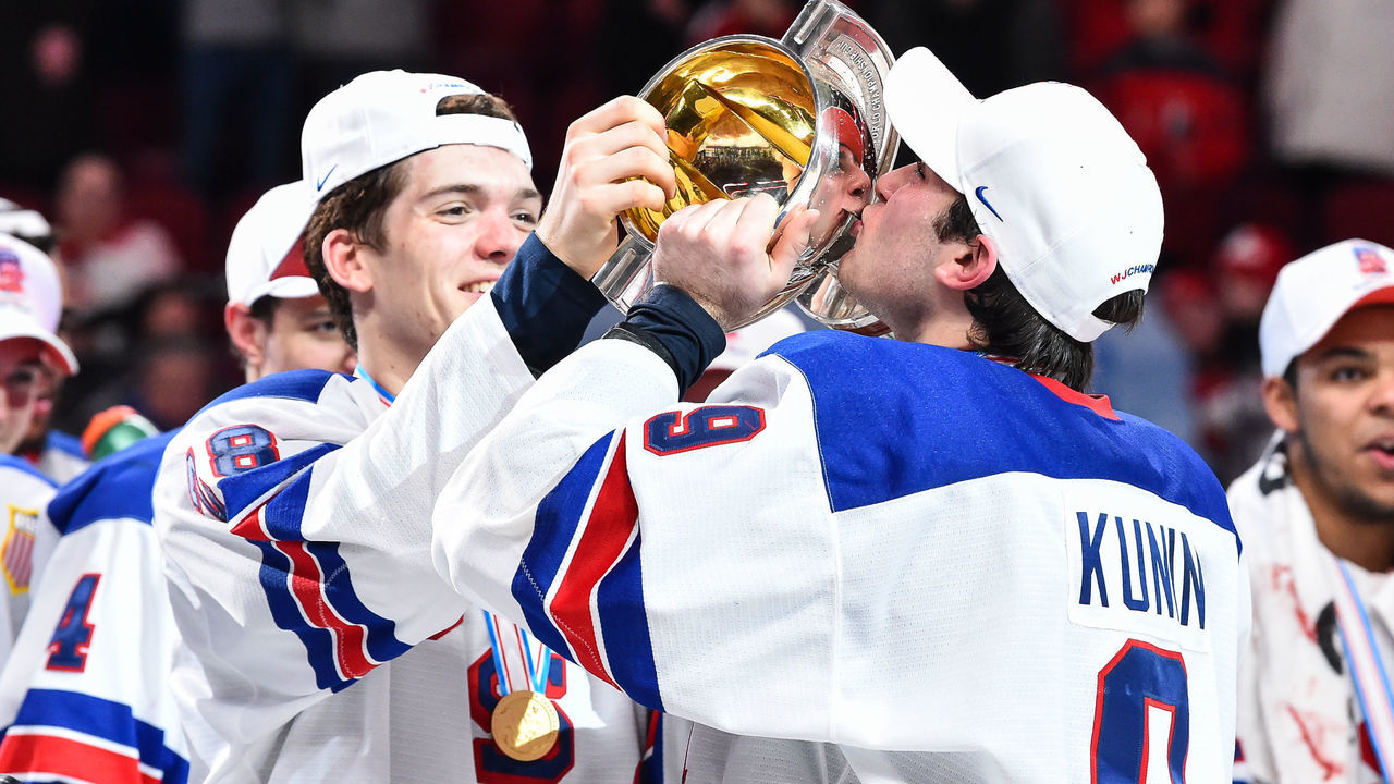 MONTREAL, QC - JANUARY 05: Luke Kunin #9 of Team United States kisses the IIHF World Junior trophy during the 2017 IIHF World Junior Championship gold medal game against Team Canada at the Bell Centre on January 5, 2017 in Montreal, Quebec, Canada. Team United States defeated Team Canada 5-4 in a shootout.