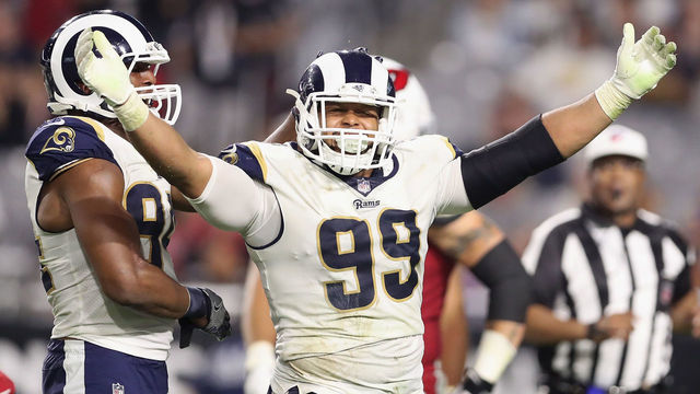 GLENDALE, AZ - DECEMBER 03: Defensive end Aaron Donald #99 of the Los Angeles Rams reacts after a tackle against the Arizona Cardinals during the second half of the NFL game at the University of Phoenix Stadium on December 3, 2017 in Glendale, Arizona. The Rams defeated the Cardinals 32-16.