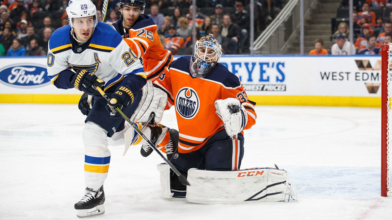 EDMONTON, AB - DECEMBER 21: Darnell Nurse #25 and goaltender Cam Talbot #33 of the Edmonton Oilers defend against Alexander Steen #20 of the St. Louis Blues at Rogers Place on December 21, 2017 in Edmonton, Canada.
