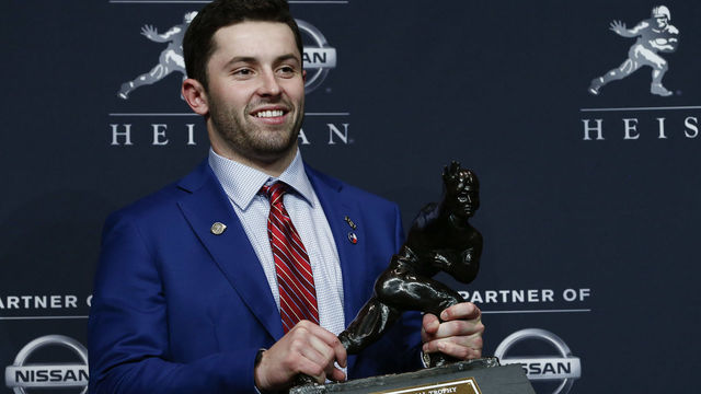 NEW YORK, NY - DECEMBER 09: Baker Mayfield, quarterback of the Oklahoma Sooners, poses for the media after the 2017 Heisman Trophy Presentation at the Marriott Marquis December 9, 2017 in New York City.