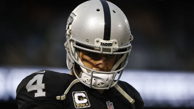 OAKLAND, CA - NOVEMBER 26: Quarterback Derek Carr #4 of the Oakland Raiders is seen on the sideline during the fourth quarter of his NFL football game against the Denver Broncos at Oakland-Alameda County Coliseum on November 26, 2017 in Oakland, California. The Raiders defeated the Broncos 21-14.