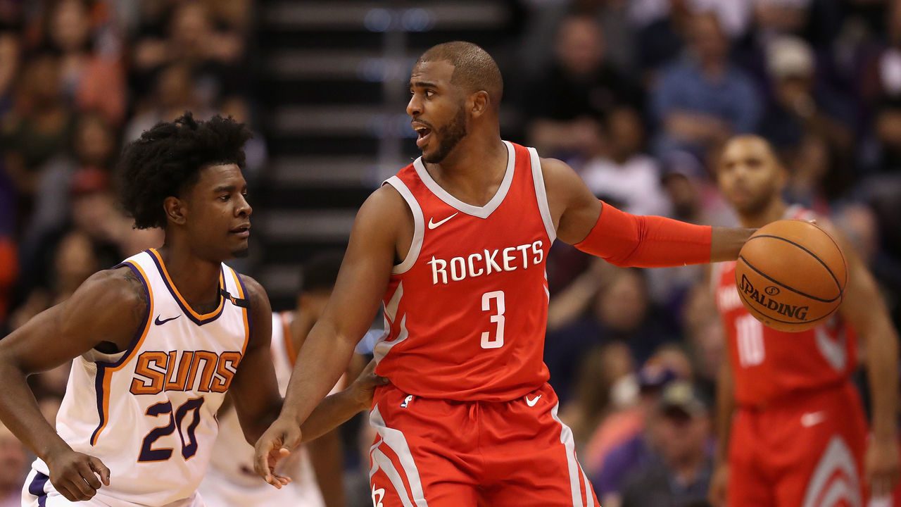 PHOENIX, AZ - NOVEMBER 16: Chris Paul #3 of the Houston Rockets handles the ball under pressure from Josh Jackson #20 of the Phoenix Suns during the second half of the NBA game at Talking Stick Resort Arena on November 16, 2017 in Phoenix, Arizona.