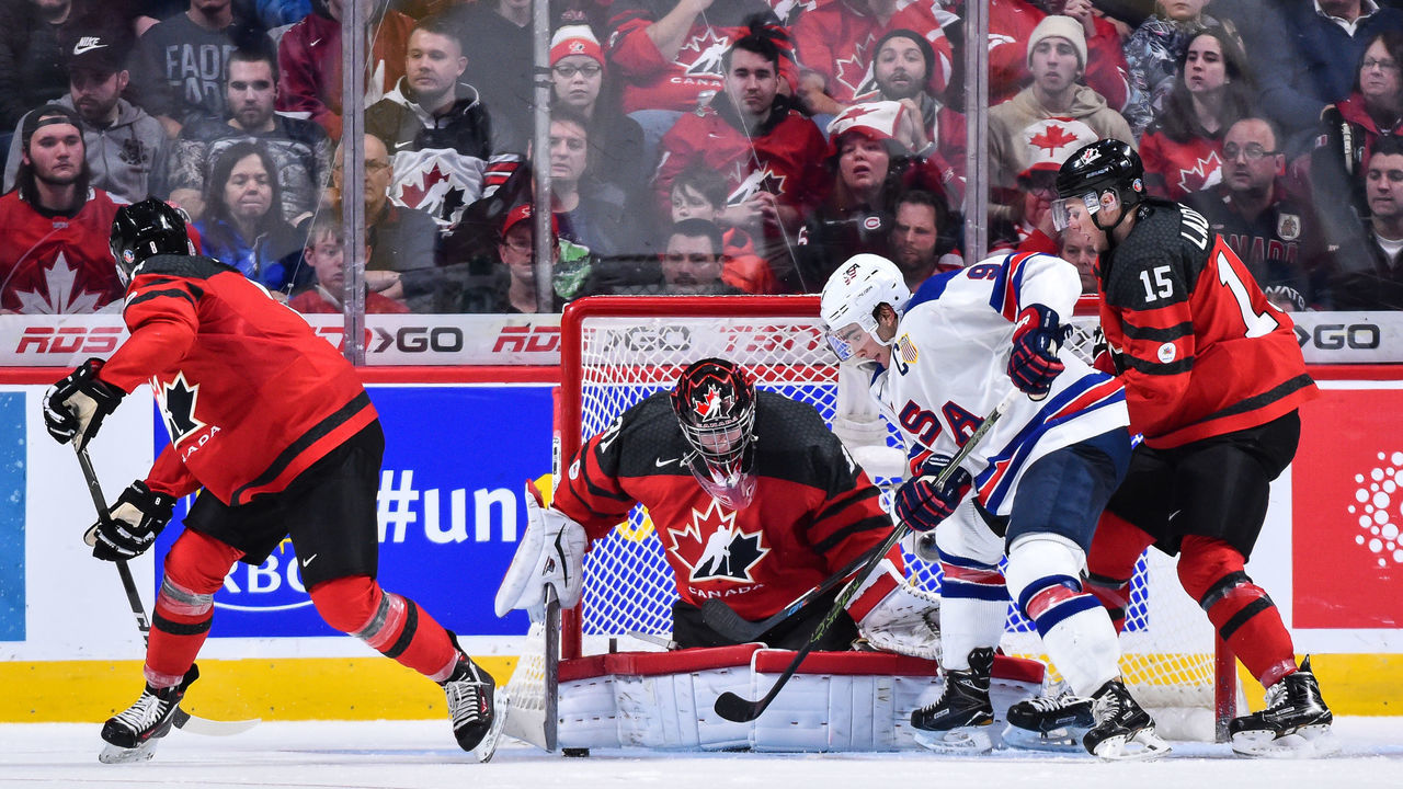 MONTREAL, QC - JANUARY 05: Goaltender Carter Hart #31 of Team Canada makes a save on Luke Kunin #9 of Team United States during the 2017 IIHF World Junior Championship gold medal game at the Bell Centre on January 5, 2017 in Montreal, Quebec, Canada. Team United States defeated Team Canada 5-4 in a shootout and win the gold medal round.