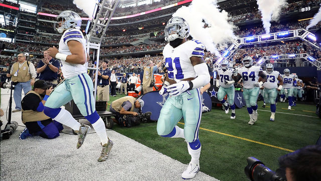 ARLINGTON, TX - NOVEMBER 05: (L-R) Dak Prescott #4 and Ezekiel Elliott #21 of the Dallas Cowboys runs onto the field before a game against the Kansas City Chiefs at AT&T Stadium on November 5, 2017 in Arlington, Texas.
