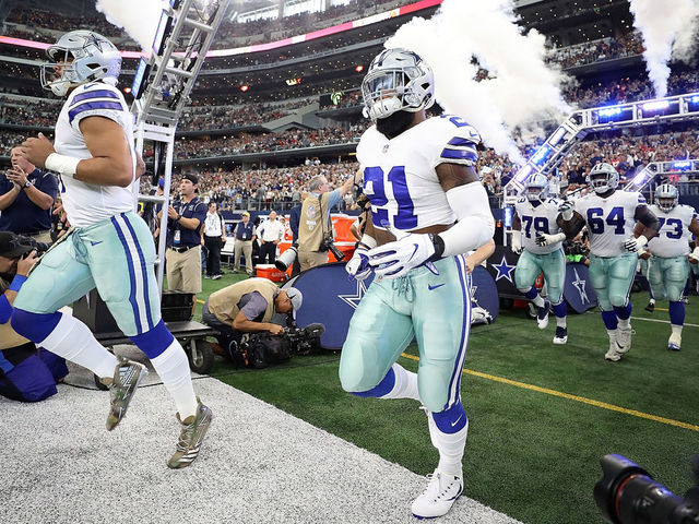 ARLINGTON, TX - NOVEMBER 05: (L-R) Dak Prescott #4 and Ezekiel Elliott #21 of the Dallas Cowboys runs onto the field before a game against the Kansas City Chiefs at AT&T Stadium on November 5, 2017 in Arlington, Texas.