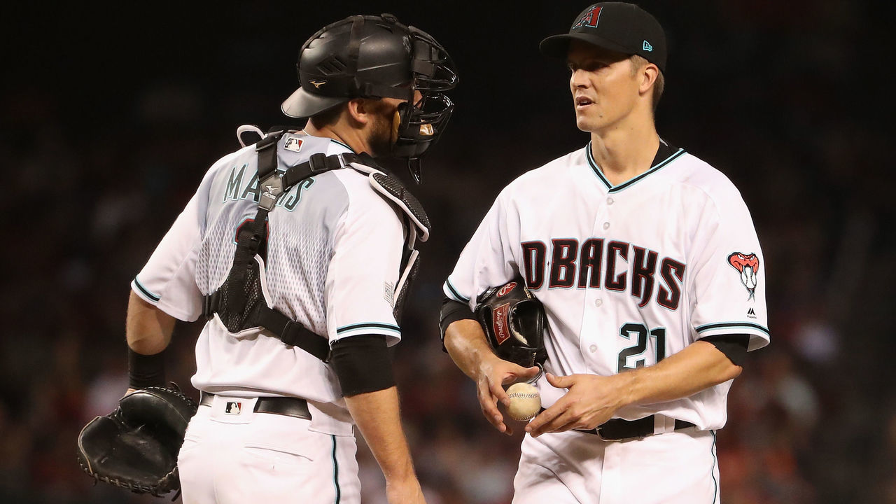 PHOENIX, AZ - OCTOBER 04: Starting pitcher Zack Greinke #21 of the Arizona Diamondbacks talks with Jeff Mathis #2 during the fourth inning of the National League Wild Card game against the Colorado Rockies at Chase Field on October 4, 2017 in Phoenix, Arizona.