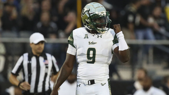 ORLANDO, FL - NOVEMBER 24: Quinton Flowers #9 of the South Florida Bulls reacts after throwing a touchdown pass in the second half against the UCF Knights at Spectrum Stadium on November 24, 2017 in Orlando, Florida.