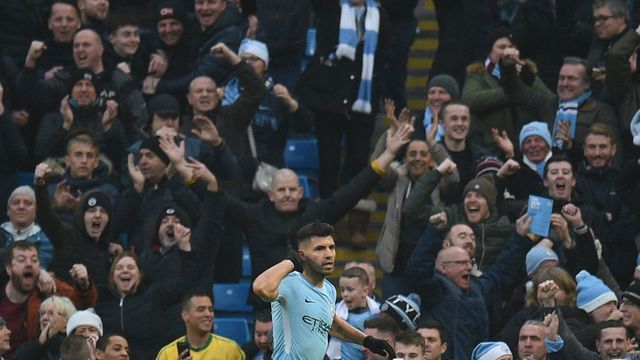Manchester City's Argentinian striker Sergio Aguero celebrates scoring the opening goal during the English Premier League football match between Manchester City and Bournemouth at the Etihad Stadium in Manchester, north west England, on December 23, 2017. / AFP PHOTO / Oli SCARFF /