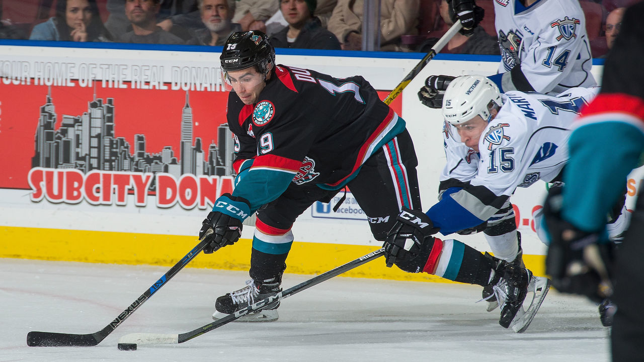 KELOWNA, BC - OCTOBER 04: Dillon Dube #19 of the Kelowna Rockets stick checks Igor Martynov #15 of the Victoria Royals at Prospera Place on October 4, 2017 in Kelowna, Canada.