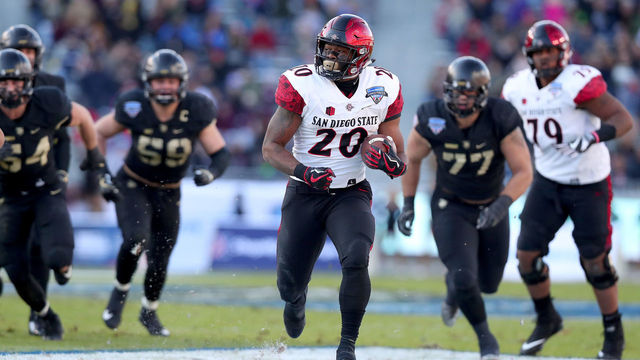 FORT WORTH, TX - DECEMBER 23: Rashaad Penny #20 of the San Diego State Aztecs scores a touchdown against the Army Black Knights in the Lockheed Martin Armed Forces Bowl at Amon G. Carter Stadium on December 23, 2017 in Fort Worth, Texas.