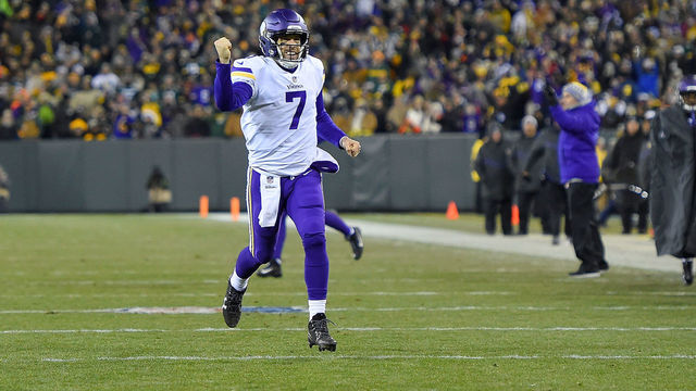 GREEN BAY, WI - DECEMBER 23: Case Keenum #7 of the Minnesota Vikings celebrates a touchdown against the Green Bay Packers during the first half at Lambeau Field on December 23, 2017 in Green Bay, Wisconsin.