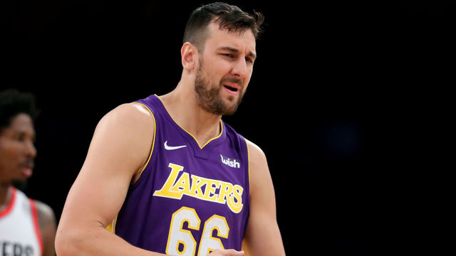 LOS ANGELES, CA - DECEMBER 23: Andrew Bogut #66 of the Los Angeles Lakers reacts to fouling out as Ed Davis #17 of the Portland Trail Blazers looks on during the second half of a game at Staples Center on December 23, 2017 in Los Angeles, California.