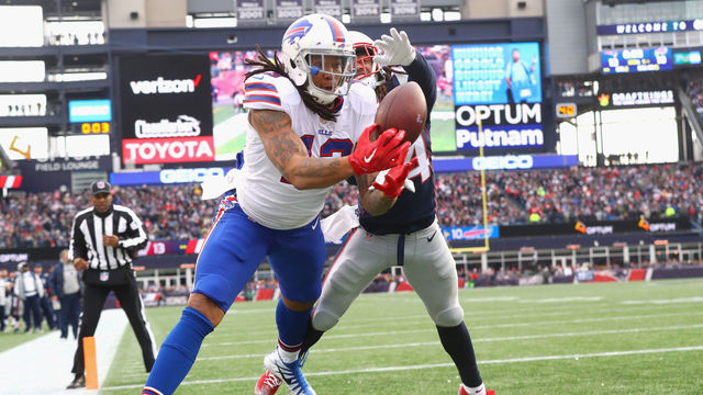 FOXBORO, MA - DECEMBER 24: Kelvin Benjamin #13 of the Buffalo Bills catches a touchdown pass as he is defended by Stephon Gilmore #24 of the New England Patriots during the quarter of a game against the Buffalo Bills at Gillette Stadium on December 24, 2017 in Foxboro, Massachusetts. The touchdown was reversed after an official review.