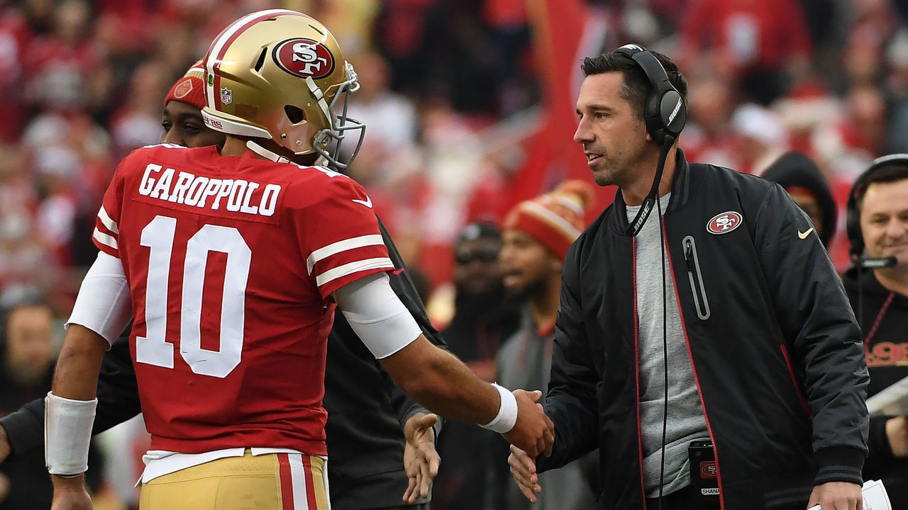SANTA CLARA, CA - DECEMBER 24: Head coach Kyle Shanahan of the San Francisco 49ers congratulates Jimmy Garoppolo #10 after a one-yard touchdown run against the Jacksonville Jaguars during their NFL game at Levi's Stadium on December 24, 2017 in Santa Clara, California.