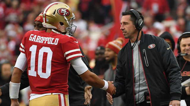 SANTA CLARA, CA - DECEMBER 24: Head coach Kyle Shanahan of the San Francisco 49ers congratulates Jimmy Garoppolo #10 after a one-yard touchdown run against the Jacksonville Jaguars during their NFL game at Levi's Stadium on December 24, 2017 in Santa Clara, California.