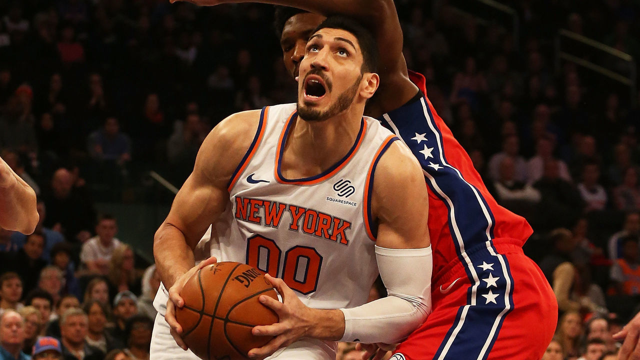 NEW YORK, NY - DECEMBER 25: Enes Kanter #00 of the New York Knicks drives to th ebasket against Joel Embiid #21 of the Philadelphia 76ers at Madison Square Garden on December 25, 2017 in New York City.
