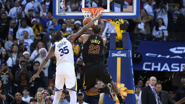 OAKLAND, CA - DECEMBER 25: Kevin Durant #35 of the Golden State Warriors blocks the shot of LeBron James #23 of the Cleveland Cavaliers late in the fouth quarter of an NBA basketball game at ORACLE Arena on December 25, 2017 in Oakland, California.