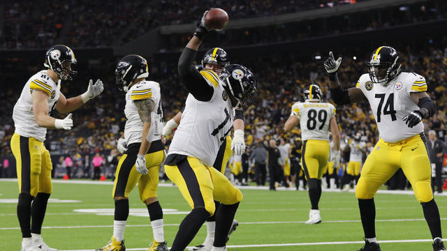 HOUSTON, TX - DECEMBER 25: Marcus Gilbert #77 of the Pittsburgh Steelers spikes the football after a touchdown by Roosevelt Nix #45 in the second quarter against the Houston Texans at NRG Stadium on December 25, 2017 in Houston, Texas.