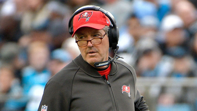 CHARLOTTE, NC - DECEMBER 24: Head coach Dirk Koetter of the Tampa Bay Buccaneers reacts between plays against the Carolina Panthers during their game at Bank of America Stadium on December 24, 2017 in Charlotte, North Carolina.