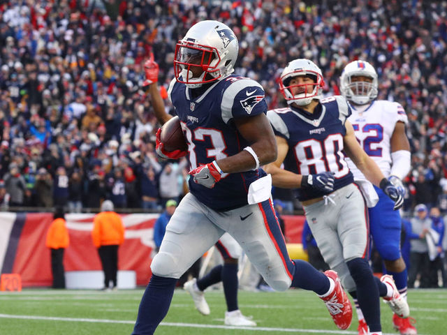 FOXBORO, MA - DECEMBER 24: Dion Lewis #33 of the New England Patriots scores a touchdown against the Buffalo Bills during the first half at Gillette Stadium on December 24, 2017 in Foxboro, Massachusetts.