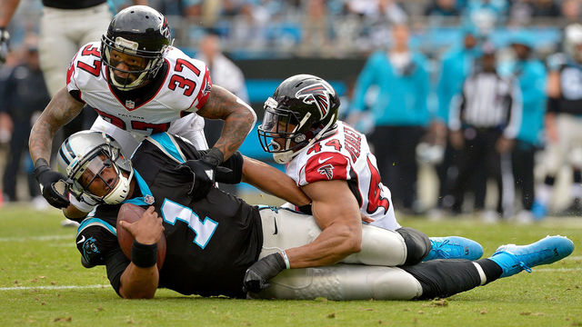 CHARLOTTE, NC - DECEMBER 24: Ricardo Allen #37 and teammate Vic Beasley #44 of the Atlanta Falcons tackle Cam Newton #1 of the Carolina Panthers in the 1st quarter during the game at Bank of America Stadium on December 24, 2016 in Charlotte, North Carolina.
