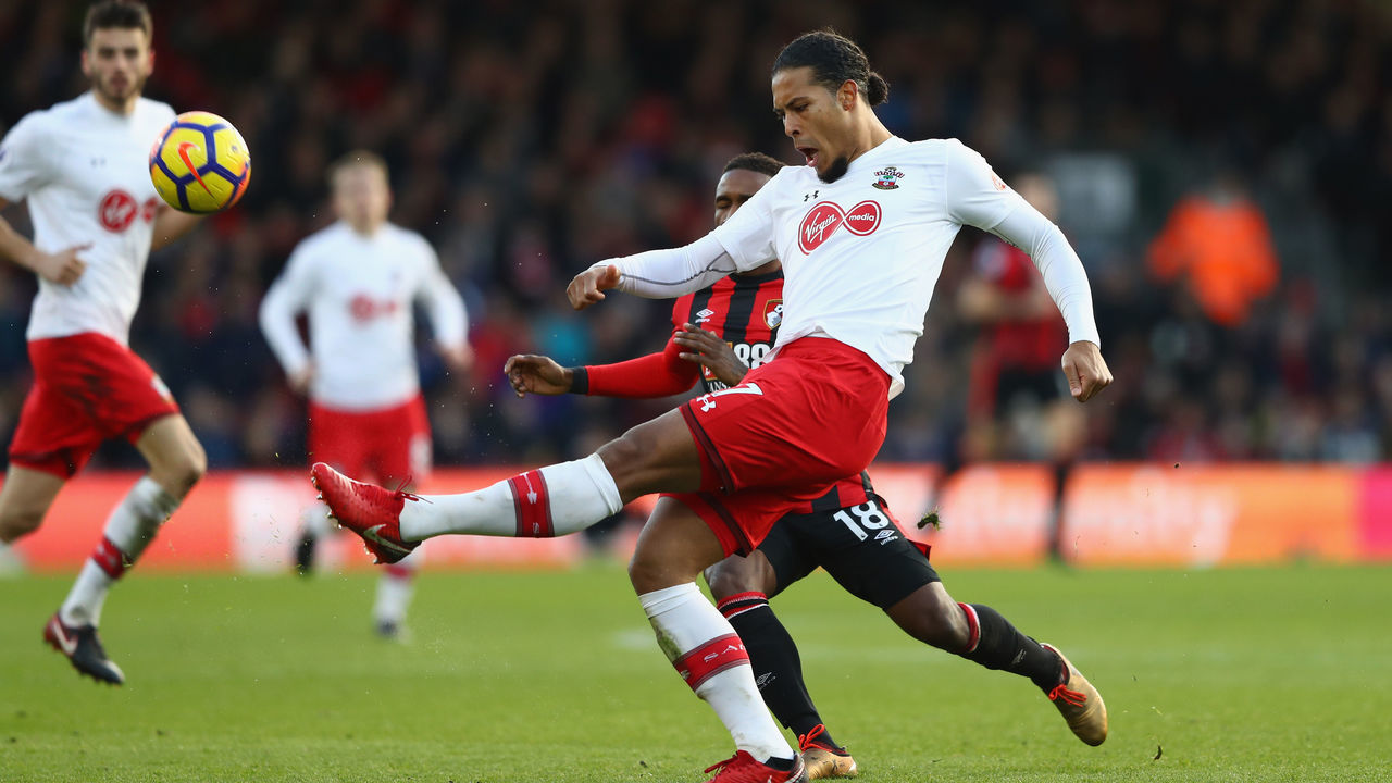 BOURNEMOUTH, ENGLAND - DECEMBER 03: Virgil van Dijk of Southampton clears the ball while under pressure from Jermain Defoe of AFC Bournemouth during the Premier League match between AFC Bournemouth and Southampton at Vitality Stadium on December 3, 2017 in Bournemouth, England.