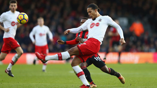 BOURNEMOUTH, ENGLAND - DECEMBER 03: Virgil van Dijk of Southampton clears the ball while under pressure from Jermain Defoe of AFC Bournemouth during the Premier League match between AFC Bournemouth and Southampton at Vitality Stadium on December 3, 2017 in Bournemouth, England.