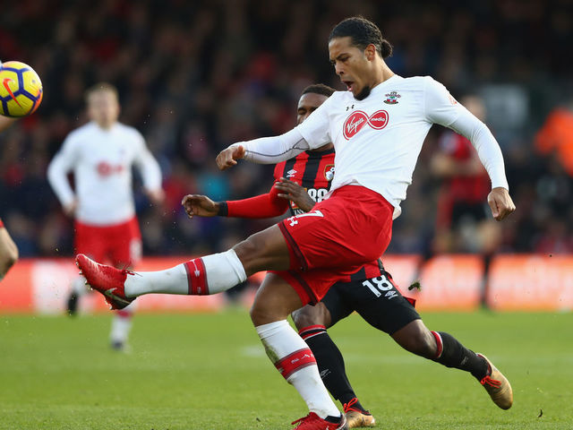 BOURNEMOUTH, ENGLAND - DECEMBER 03: Virgil van Dijk of Southampton clears the ball while under pressure from Jermain Defoe of AFC Bournemouth during the Premier League match between AFC Bournemouth and Southampton at Vitality Stadium on December 3, 2017 in Bournemouth, England.