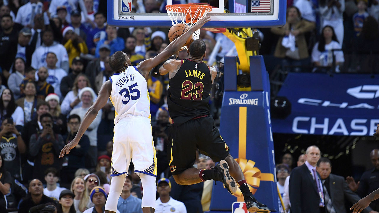 OAKLAND, CA - DECEMBER 25: Kevin Durant #35 of the Golden State Warriors blocks the shot of LeBron James #23 of the Cleveland Cavaliers late in the fouth quarter of an NBA basketball game at ORACLE Arena on December 25, 2017 in Oakland, California.