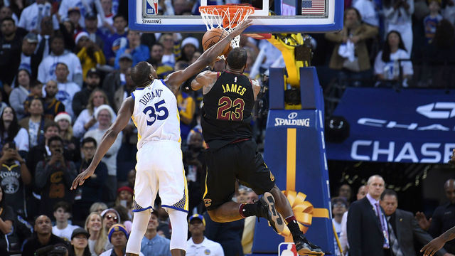 OAKLAND, CA - DECEMBER 25: Kevin Durant #35 of the Golden State Warriors blocks the shot of LeBron James #23 of the Cleveland Cavaliers late in the fouth quarter of an NBA basketball game at ORACLE Arena on December 25, 2017 in Oakland, California.