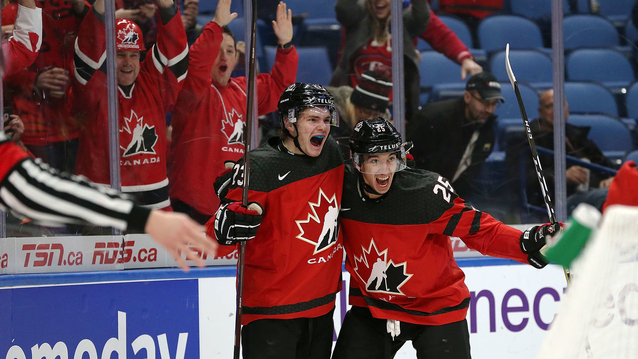 BUFFALO, NY - DECEMBER 26: Sam Steel #23 of Canada celebrates his goal against Finland with Jordan Kyrou #25 during the first period at KeyBank Center on December 26, 2017 in Buffalo, New York.