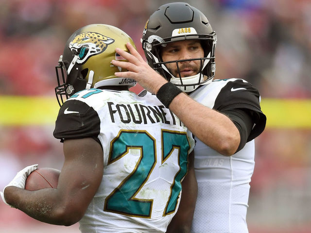 SANTA CLARA, CA - DECEMBER 24: Leonard Fournette #27 of the Jacksonville Jaguars is congratulated by Blake Bortles #5 after Fournette scored on a 1-yard touchdown run against the San Francisco 49ers during their NFL football game at Levi's Stadium on December 24, 2017 in Santa Clara, California.