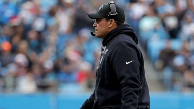 CHARLOTTE, NC - DECEMBER 24: Head coach Ron Rivera of the Carolina Panthers walks on to the field against the Tampa Bay Buccaneers in the second quarter during their game at Bank of America Stadium on December 24, 2017 in Charlotte, North Carolina.