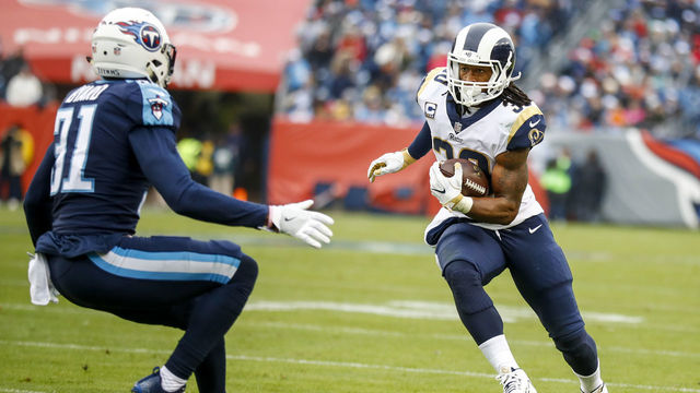 NASHVILLE, TN - DECEMBER 24: Running Back Todd Gurley II #30 of the Los Angeles Rams carries the ball against Safety Kevin Byard #31 of the Tennessee Titans at Nissan Stadium on December 24, 2017 in Nashville, Tennessee.