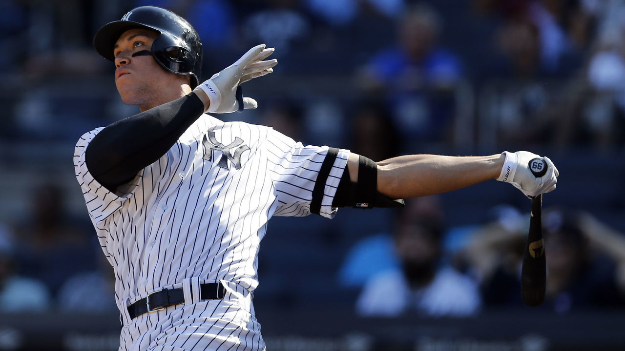 NEW YORK, NY - SEPTEMBER 25: Aaron Judge #99 of the New York Yankees hits a solo home run against the Kansas City Royals during the seventh inning at Yankee Stadium on September 25, 2017 in the Bronx borough of New York City. The home run was number 50 on the season.