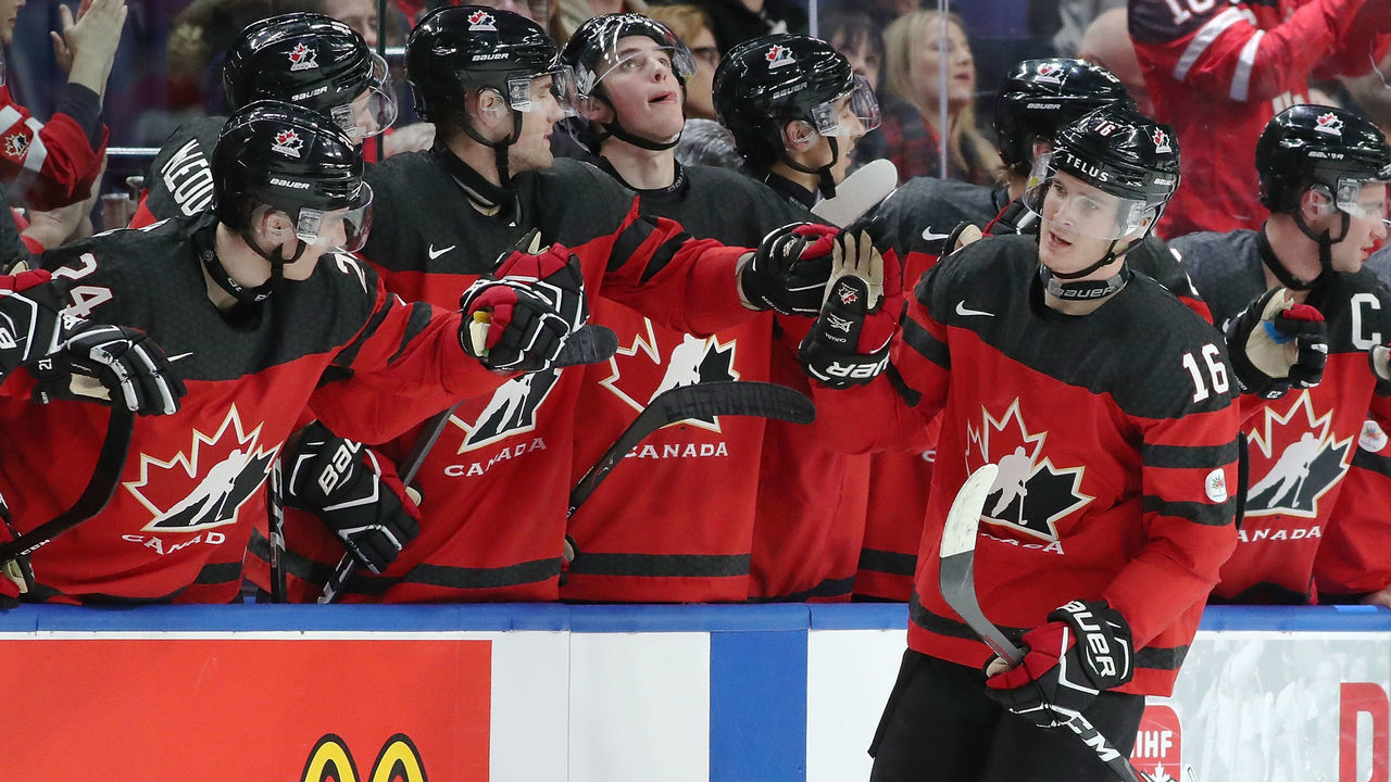 BUFFALO, NY - DECEMBER 26: Taylor Raddysh #16 of Canada celebrates with the bench after he scored on Finland during the second period at KeyBank Center on December 26, 2017 in Buffalo, New York.
