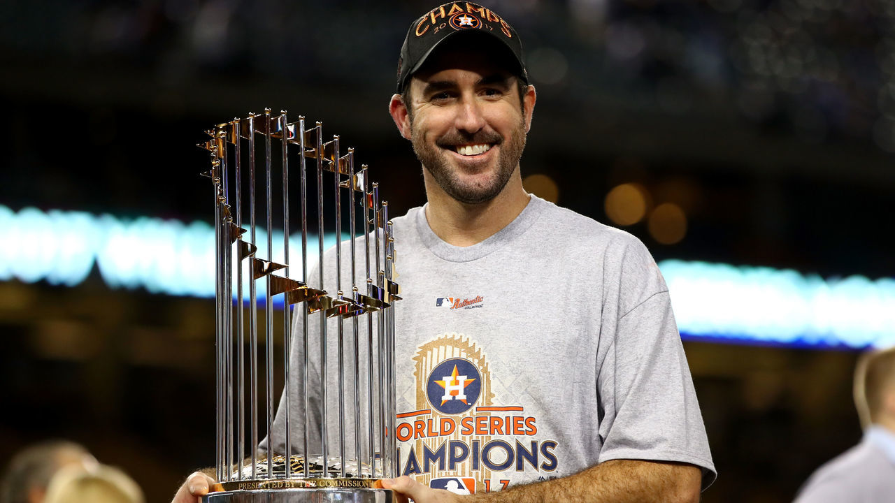 LOS ANGELES, CA - NOVEMBER 01: Justin Verlander #35 of the Houston Astros holds the Commissioner's Trophy after defeating the Los Angeles Dodgers 5-1 in game seven to win the 2017 World Series at Dodger Stadium on November 1, 2017 in Los Angeles, California.
