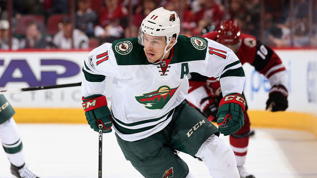 GLENDALE, AZ - APRIL 08: Zach Parise #11 of the Minnesota Wild skates with the puck ahead of Marco Scandella #6 and Anthony Duclair #10 of the Arizona Coyotes during the third period of the NHL game at Gila River Arena on April 8, 2017 in Glendale, Arizona. The Wild defeated the Coyotes 3-1.