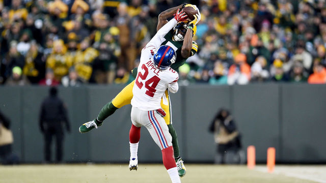 GREEN BAY, WI - JANUARY 8: Davante Adams #17 of the Green Bay Packers makes a catch while being guarded by Eli Apple #24 of the New York Giants in the second quarter during the NFC Wild Card game at Lambeau Field on January 8, 2017 in Green Bay, Wisconsin.