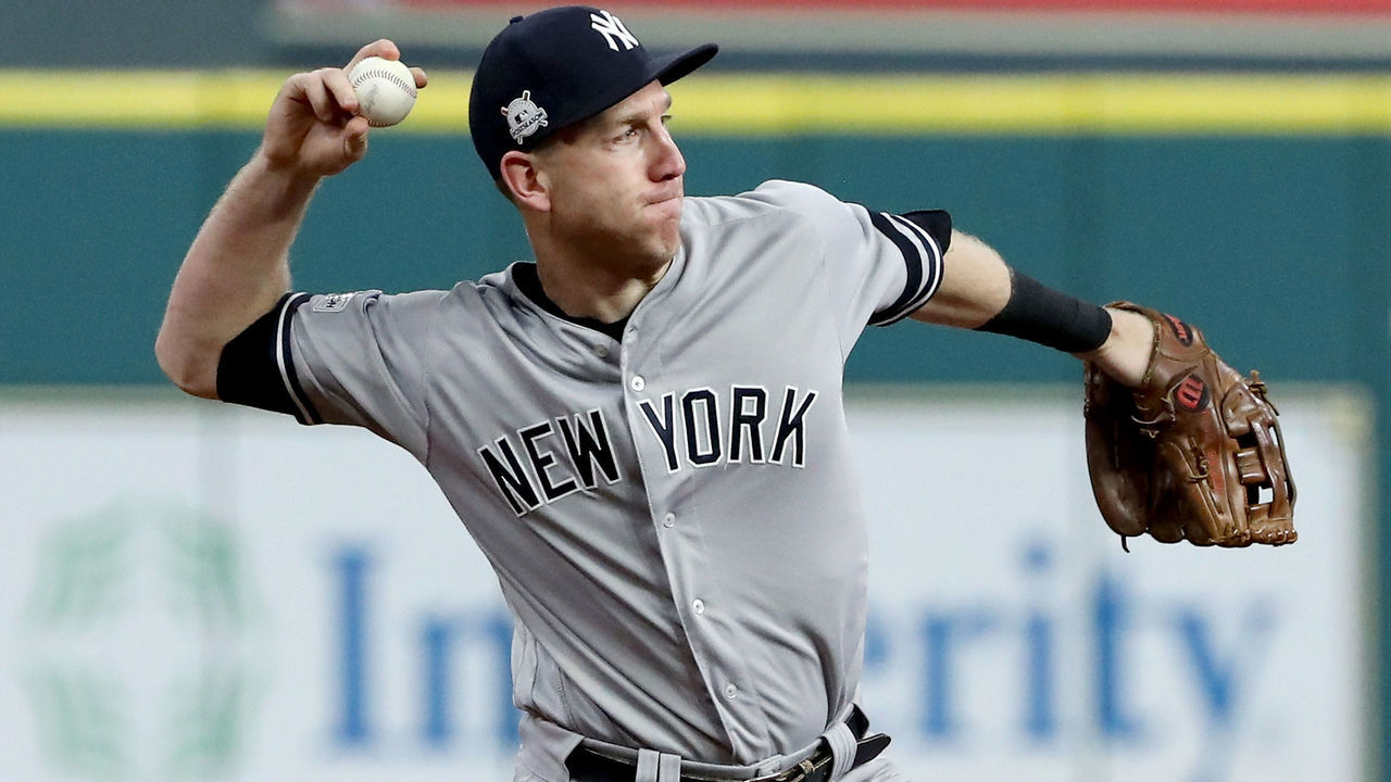 HOUSTON, TX - OCTOBER 21: Todd Frazier #29 of the New York Yankees fields a hit by George Springer #4 of the Houston Astros during the third inning in Game Seven of the American League Championship Series at Minute Maid Park on October 21, 2017 in Houston, Texas.