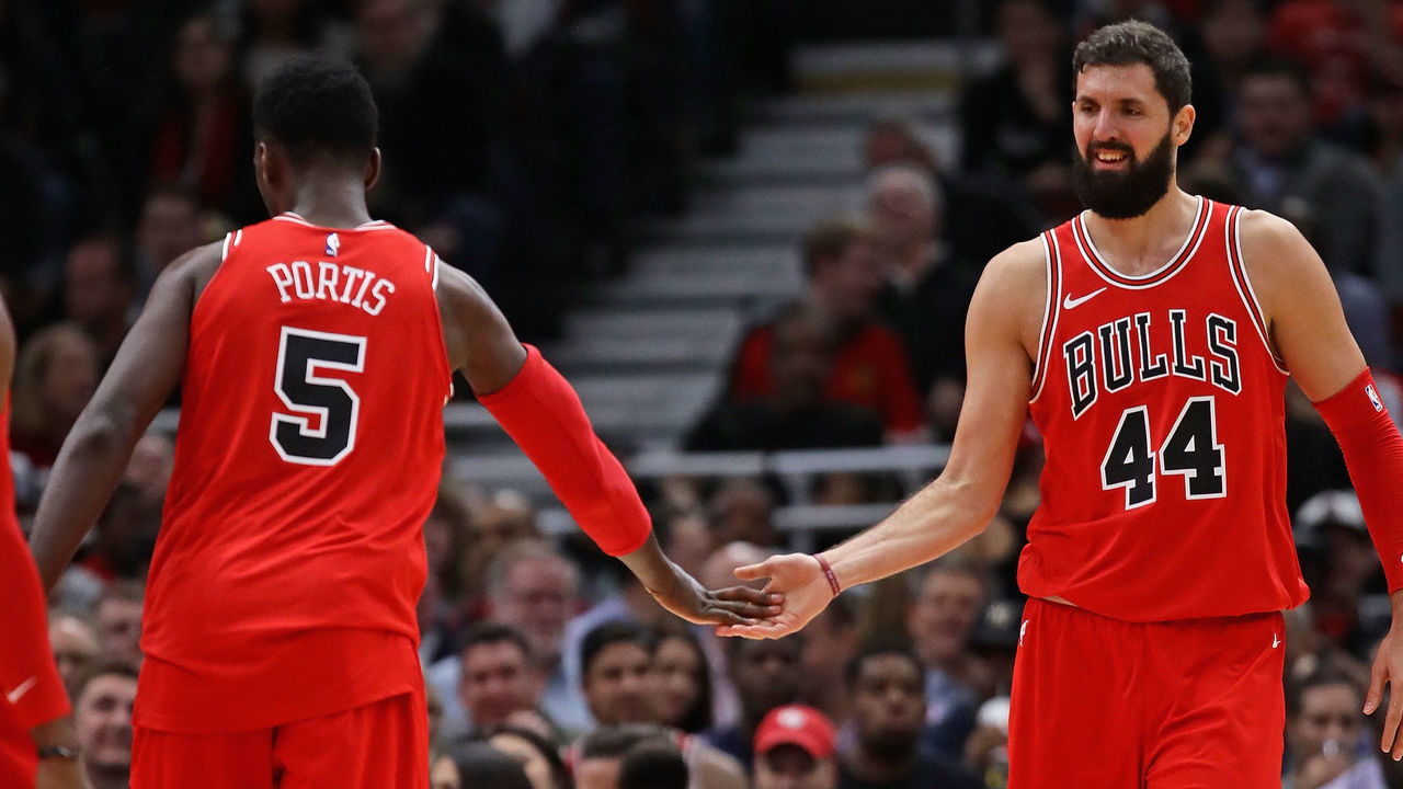 CHICAGO, IL - DECEMBER 18: Nikola Mirotic #44 and Bobby Portis #5 of the Chicago Bulls congratulate each other after a play against the Philadelphia 76ers at the United Center on December 18, 2017 in Chicago, Illinois. The Bulls defeated the 76ers 117-115.